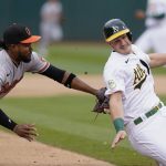 
              CORRECTS A'S PLAYER TO SEAN MURPHY, INSTEAD OF SETH BROWN - Baltimore Orioles third baseman Kelvin Gutierrez, left, tags out Oakland Athletics' Sean Murphy during the fourth inning of a baseball game in Oakland, Calif., Wednesday, April 20, 2022. (AP Photo/Jeff Chiu)
            