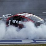 
              Ross Chastain celebrates with a burnout after winning a NASCAR Cup Series auto race Sunday, April 24, 2022, in Talladega, Ala. (AP Photo/Butch Dill)
            