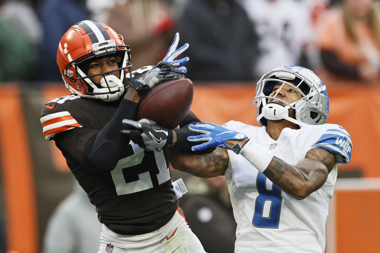 FILE - Cleveland Browns cornerback Denzel Ward (21) intercepts a pass intended for Detroit Lions wi...