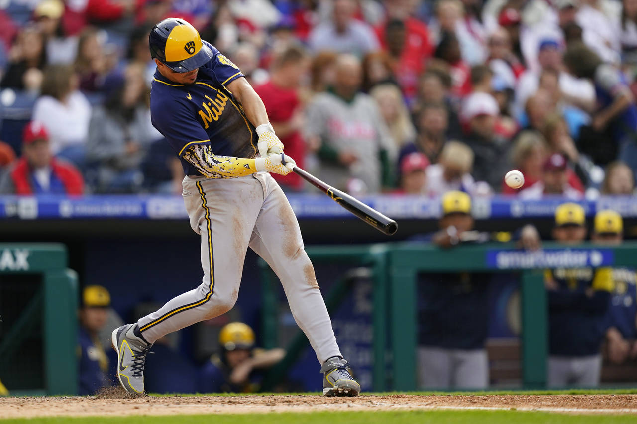 Milwaukee Brewers' Willy Adames hits a run-scoring single off Philadelphia Phillies starting pitche...