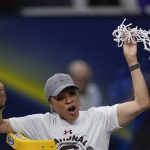 
              South Carolina head coach Dawn Staley cuts the net after a college basketball game in the final round of the Women's Final Four NCAA tournament against UConn Sunday, April 3, 2022, in Minneapolis. South Carolina won 64-49 to win the championship. (AP Photo/Charlie Neibergall)
            