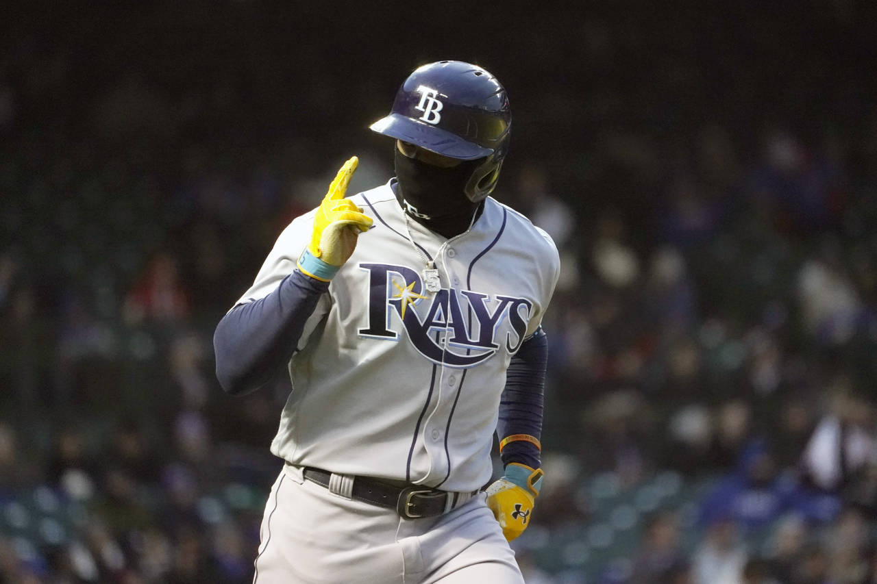 Tampa Bay Rays' Wander Franco looks at his teammates as he celebrates his two-run home run off Chic...