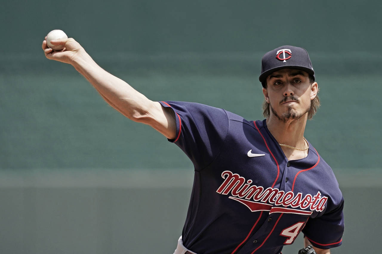 Minnesota Twins starting pitcher Joe Ryan throws during the first inning of a baseball game against...