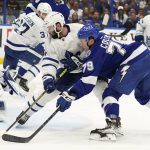 
              Tampa Bay Lightning center Ross Colton (79) watches his goal get past Toronto Maple Leafs goaltender Erik Kallgren (50) and center Colin Blackwell (11) during the second period of an NHL hockey game Thursday, April 21, 2022, in Tampa, Fla. (AP Photo/Chris O'Meara)
            