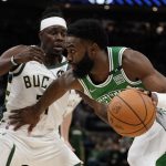 
              Boston Celtics' Jaylen Brown tries to get past Milwaukee Bucks' Jrue Holiday during the second half of an NBA basketball game Thursday, April 7, 2022, in Milwaukee. The Bucks won 127-121. (AP Photo/Morry Gash)
            