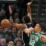 
              Boston Celtics' Grant Williams (12) blocks a shot by Brooklyn Nets' Bruce Brown (1) during the first half of Game 2 of an NBA basketball first-round playoff series Wednesday, April 20, 2022, in Boston. (AP Photo/Michael Dwyer)
            