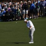 
              Dustin Johnson chips to the second green during the second round at the Masters golf tournament on Friday, April 8, 2022, in Augusta, Ga. (AP Photo/Matt Slocum)
            