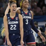 
              UConn's Evina Westbrook and Aaliyah Edwards react after a college basketball game in the semifinal round of the Women's Final Four NCAA tournament Friday, April 1, 2022, in Minneapolis. UConn won 63-58 to advance to the finals. (AP Photo/Eric Gay)
            