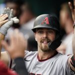 
              Arizona Diamondbacks' Cooper Hummel is congratulated for his two-run home run during the fifth inning of the team's baseball game against the Washington Nationals at Nationals Park, Thursday, April 21, 2022, in Washington. (AP Photo/Alex Brandon)
            