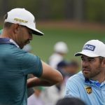 
              Louis Oosthuizen, right, of South Africa, speaks with Erik van Rooyen, of South Africa, on the 12th hole during a practice round for the Masters golf tournament on Tuesday, April 5, 2022, in Augusta, Ga. (AP Photo/Robert F. Bukaty)
            