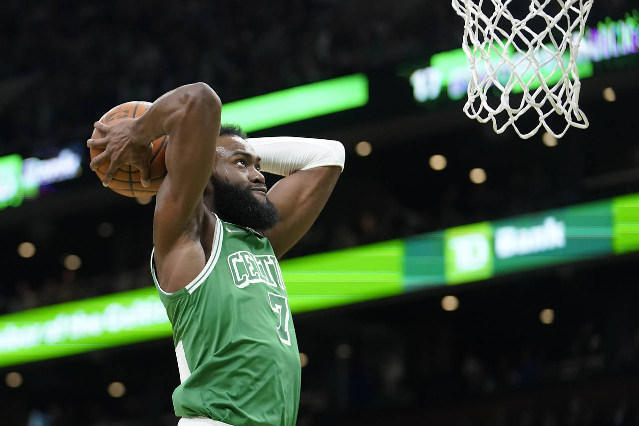 Boston Celtics guard Jaylen Brown (7) shoots at the basket in the first half of an NBA basketball g...