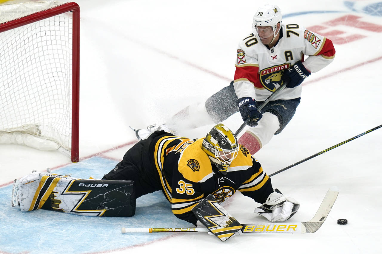 Boston Bruins goaltender Linus Ullmark (35) scrambles after the puck as Florida Panthers right wing...