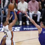 
              New Orleans Pelicans guard CJ McCollum (3) shoots against Phoenix Suns guard Devin Booker (1) in the first half of game 6 of an NBA basketball first-round playoff series, Thursday, April 28, 2022 in New Orleans. (AP Photo/Gerald Herbert)
            