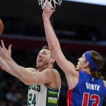 
              Milwaukee Bucks guard Pat Connaughton (24) drives on Detroit Pistons forward Kelly Olynyk (13) in the first half of an NBA basketball game in Detroit, Friday, April 8, 2022. (AP Photo/Paul Sancya)
            