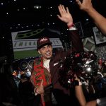 
              Southern California wide receiver Drake London celebrates with supporters after being chosen by the Atlanta Falcons with the eighth pick of the NFL football draft Thursday, April 28, 2022, in Las Vegas. (AP Photo/Jae C. Hong)
            