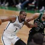 
              Brooklyn Nets forward Kevin Durant (7) looks for an opening around Boston Celtics forward Jayson Tatum (0) in the second half of Game 1 of an NBA basketball first-round Eastern Conference playoff series, Sunday, April 17, 2022, in Boston. The Celtics won 115-114. (AP Photo/Steven Senne)
            