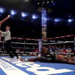 
              Britain’s Tyson Fury, left, celebrates after knocking down Britain’s Dillian Whyte to win their WBC heavyweight title boxing fight at Wembley Stadium in London, Saturday, April 23, 2022. (Nick Potts/PA via AP)
            