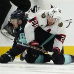 
              Ottawa Senators right wing Connor Brown (28) falls on top of Seattle Kraken left wing Jared McCann, left, during the first period of an NHL hockey game, Monday, April 18, 2022, in Seattle. (AP Photo/Ted S. Warren)
            