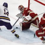 
              Minnesota State's Ryan Sandelin (14) tries to get the puck past Denver's Magnus Chrona (30) during the first period of the NCAA men's Frozen Four championship college hockey game Saturday, April 9, 2022, in Boston. (AP Photo/Michael Dwyer)
            