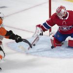 
              Philadelphia Flyers' Morgan Frost (48) scores on Montreal Canadiens goaltender Carey Price during the third period of an NHL hockey game Thursday, April 21, 2022, in Montreal. (Graham Hughes/The Canadian Press via AP)
            