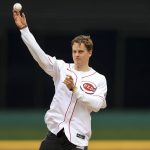 
              Cincinnati Bengals' Joe Burrow throws out the ceremonial first pitch prior to a baseball game between the Cleveland Guardians and the Cincinnati Reds in Cincinnati, Tuesday, April 12, 2022. (AP Photo/Aaron Doster)
            