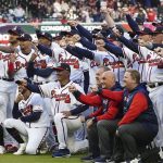 
              Atlanta Braves poses with their World Series rings after a receiving them before a baseball game against the Cincinnati Reds on Saturday, April 9, 2022, in Atlanta. (AP Photo/John Bazemore)
            