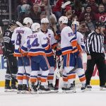 
              New York Islanders' Jean-Gabriel Pageau (44) celebrates with teammates after his second goal during the first period of an NHL hockey game against the New Jersey Devils in Newark, N.J., Sunday, April 3, 2022. (AP Photo/Seth Wenig)
            