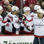 
              Washington Capitals' Alex Ovechkin (8) is greeted by teammates on the bench after scoring a power play goal against the Pittsburgh Penguins during the second period of an NHL hockey game, Saturday, April 9, 2022, in Pittsburgh. (AP Photo/Keith Srakocic)
            