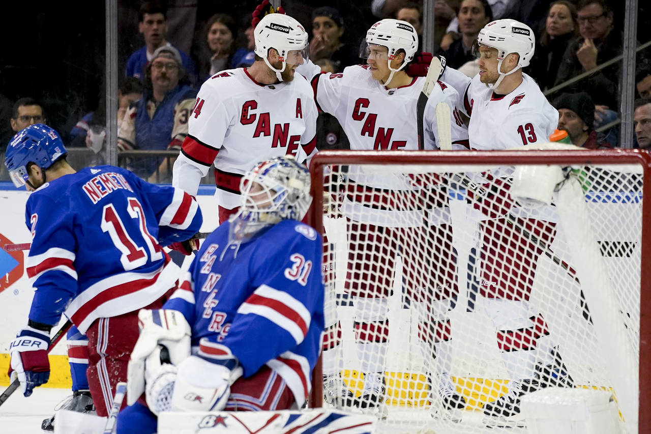 Carolina Hurricanes left wing Teuvo Teravainen, second from right, celebrates after scoring on New ...