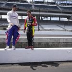 
              Alexander Rossi, left, and Delvin Defrancesco look at pit lane before testing at Indianapolis Motor Speedway, Thursday, April 21, 2022, in Indianapolis. (AP Photo/Darron Cummings)
            