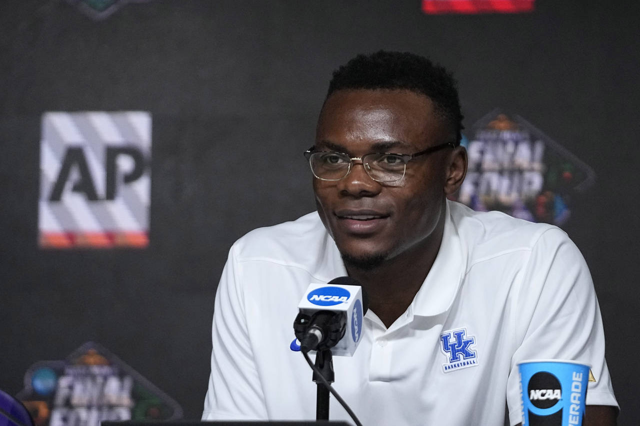 Oscar Tshiebwe of Kentucky speaks as he is introduced as The Associated Press men's basketball play...