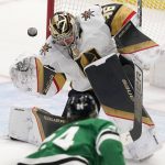 
              Vegas Golden Knights goaltender Logan Thompson (36) blocks a shot by Dallas Stars center Roope Hintz (24) during the second period of an NHL hockey game in Dallas, Tuesday, April 26, 2022. (AP Photo/LM Otero)
            