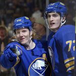 
              Buffalo Sabres defenseman Rasmus Dahlin (26) and right wing Tage Thompson (72) celebrate a goal by Dahlin during the second period of an NHL hockey game against the Philadelphia Flyers on Saturday, April. 16, 2022, in Buffalo, N.Y. (AP Photo/Joshua Bessex)
            