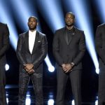 
              FILE - NBA basketball players Carmelo Anthony, Chris Paul, Dwyane Wade and LeBron James, from left, speak on stage at the ESPY Awards in Los Angeles on July 13, 2016. The four gave an anti-violence speech and expressed their support of the values behind the Black Lives Matter movement. (Photo by Chris Pizzello/Invision/AP, File)
            