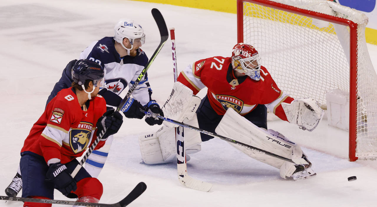 Florida Panthers goaltender Sergei Bobrovsky (72) kicks aside a shot by Winnipeg Jets left wing Pie...