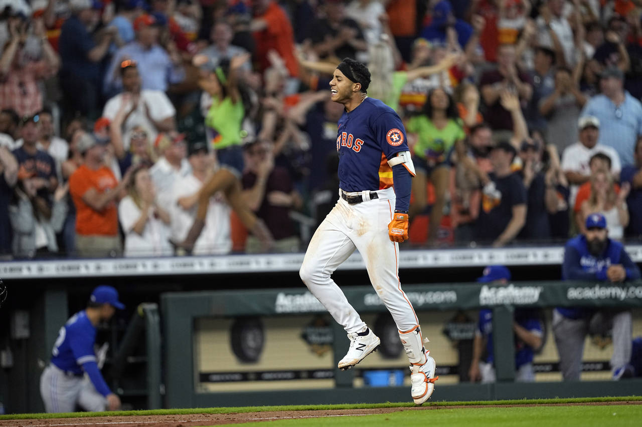 Houston Astros' Jeremy Pena celebrates after hitting a game-winning two-run home run against the To...