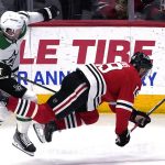 
              Chicago Blackhawks center Jonathan Toews, right, is checked by Dallas Stars defenseman Ryan Suter during the third period of an NHL hockey game in Chicago, Sunday, April, 10, 2022. The Stars won 6-4.(AP Photo/Nam Y. Huh)
            
