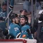 
              San Jose Sharks center Scott Reedy (54) celebrates with Jasper Weatherby (26) after scoring a goal against the Columbus Blue Jackets during the first period in an NHL hockey game Tuesday, April 19, 2022, in San Jose, Calif. (AP Photo/Tony Avelar)
            