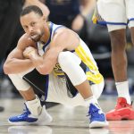 
              Golden State Warriors guard Stephen Curry reacts after hitting a 3-point-basket in the second half of Game 4 of an NBA basketball first-round Western Conference playoff series against the Denver Nuggets, Sunday, April 24, 2022, in Denver. (AP Photo/David Zalubowski)
            