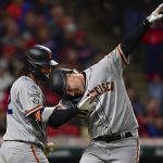 
              San Francisco Giants' Joc Pederson, right, celebrates with Brandon Crawford after hitting a solo home run off Cleveland Guardians starting pitcher Zach Plesac in the sixth inning of a baseball game, Friday, April 15, 2022, in Cleveland. (AP Photo/David Dermer)
            
