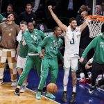 
              Boston Celtics forward Jayson Tatum (0) reacts as his team holds the lead during the second half of Game 4 of an NBA basketball first-round playoff series against the Brooklyn Nets, Monday, April 25, 2022, in New York. (AP Photo/John Minchillo)
            