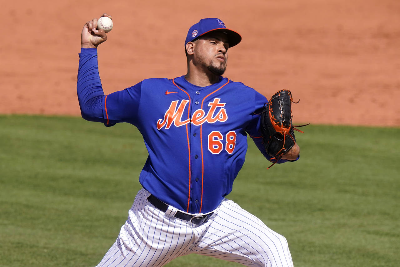 FILE - New York Mets relief pitcher Dellin Betances throws during the fifth inning of a spring trai...
