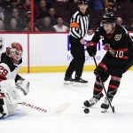 
              Ottawa Senators left wing Alex Formenton (10) moves towards a rebound in front of New Jersey Devils goaltender Mackenzie Blackwood (29) during the second period of an NHL hockey game in Ottawa, on Tuesday, April 26, 2022. (Justin Tang/The Canadian Press via AP)
            