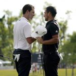 
              Patrick Cantlay and his teammate Xander Schauffele, right, congratulate each other after their win in the PGA Zurich Classic golf tournament at TPC Louisiana in Avondale, La., Sunday, April 24, 2022. (AP Photo/Gerald Herbert)
            