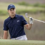 
              Jordan Spieth watches his shot from a bunker on the 18th hole during a one-hole playoff at the RBC Heritage golf tournament, Sunday, April 17, 2022, in Hilton Head Island, S.C. (AP Photo/Stephen B. Morton)
            