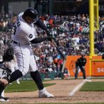 
              Detroit Tigers' Miguel Cabrera connects for a two-run single during the eighth inning of a baseball game against the Chicago White Sox, Friday, April 8, 2022, in Detroit. (AP Photo/Carlos Osorio)
            