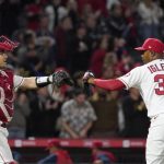 
              Los Angeles Angels catcher Max Stassi, left, and relief pitcher Raisel Iglesias congratulate each other after the Angels defeated the Miami Marlins 6-2 in a baseball game Monday, April 11, 2022, in Anaheim, Calif. (AP Photo/Mark J. Terrill)
            