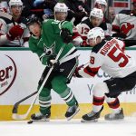 
              Dallas Stars center Joe Pavelski (16) tries to keep the puck from New Jersey Devils center Janne Kuokkanen (59) during the first period of an NHL hockey game in Dallas, Saturday, April 9, 2022. (AP Photo/Michael Ainsworth)
            