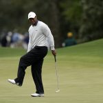 
              Tiger Woods reacts after missing a birdie putt on the eighth green during the third round at the Masters golf tournament on Saturday, April 9, 2022, in Augusta, Ga. (AP Photo/David J. Phillip)
            