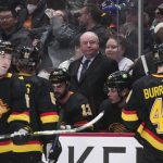
              Vancouver Canucks coach Bruce Boudreau stands behind the bench during the third period of the team's NHL hockey game against the Seattle Kraken on Tuesday, April 26, 2022, in Vancouver, British Columbia. (Darryl Dyck/The Canadian Press via AP)
            